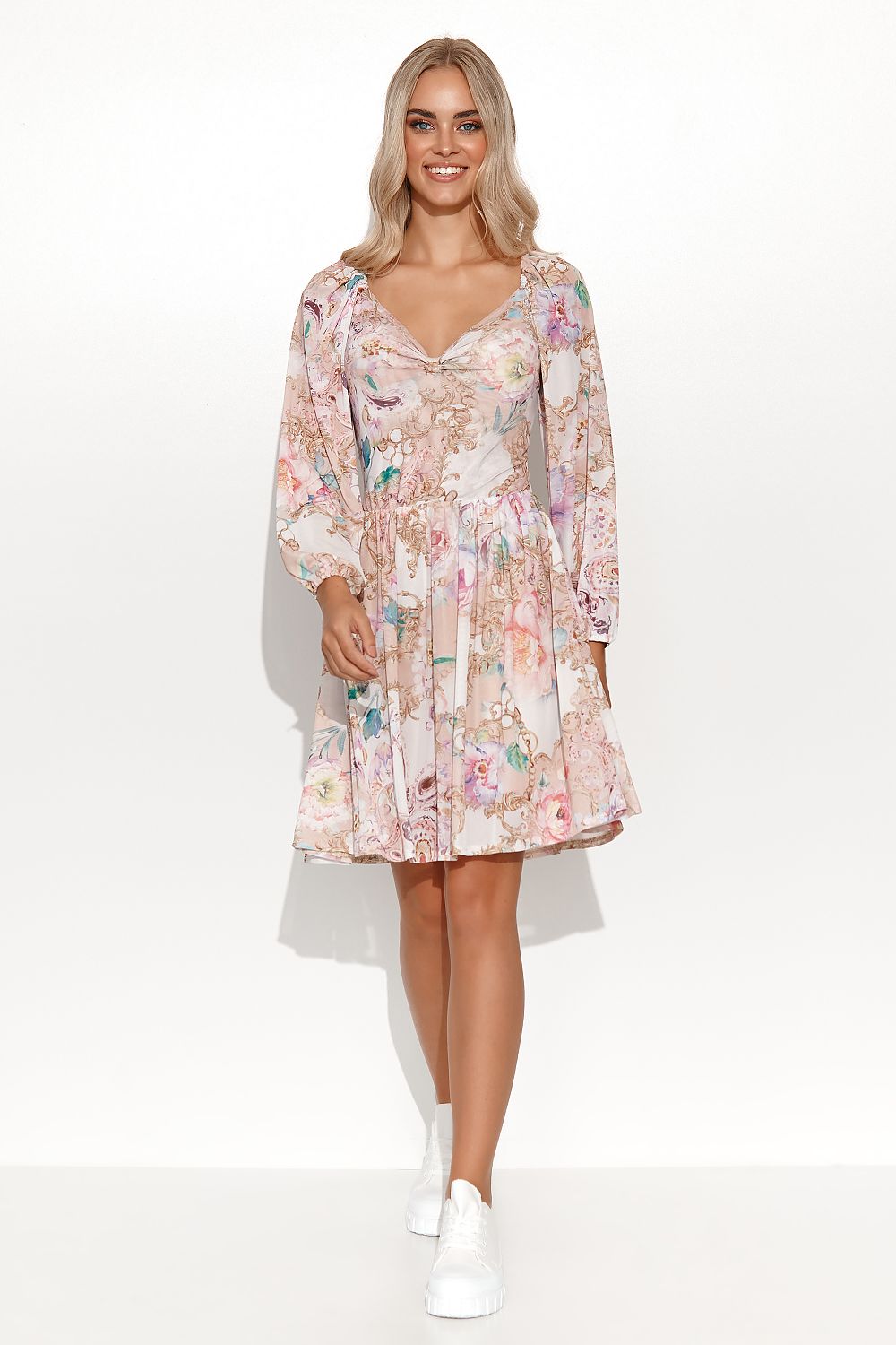 Stylish Makadamia floral daydress with a flattering high-cut neckline, long sleeves, and an airy skirt, ideal for sophisticated casual wear.