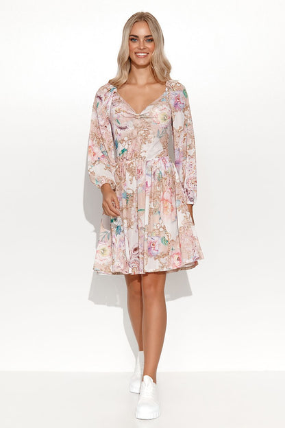 Stylish Makadamia floral daydress with a flattering high-cut neckline, long sleeves, and an airy skirt, ideal for sophisticated casual wear.