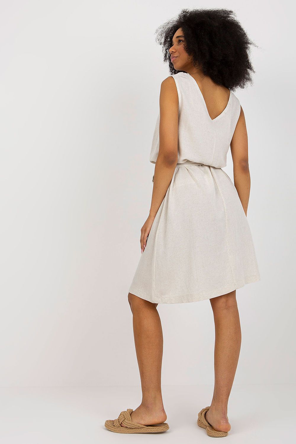 Sophisticated back view of an elegant sleeveless summer dress by Rue Paris, highlighting the v-neckline and stylish waist tie, perfect for summer outings in a light fabric.