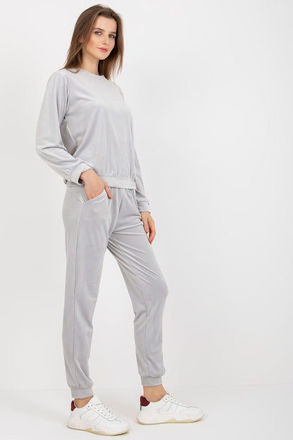 Chic grey velour lounge set by Rue Paris, showcasing a sophisticated blouse paired with comfortable long pants, ideal for stylish relaxation.