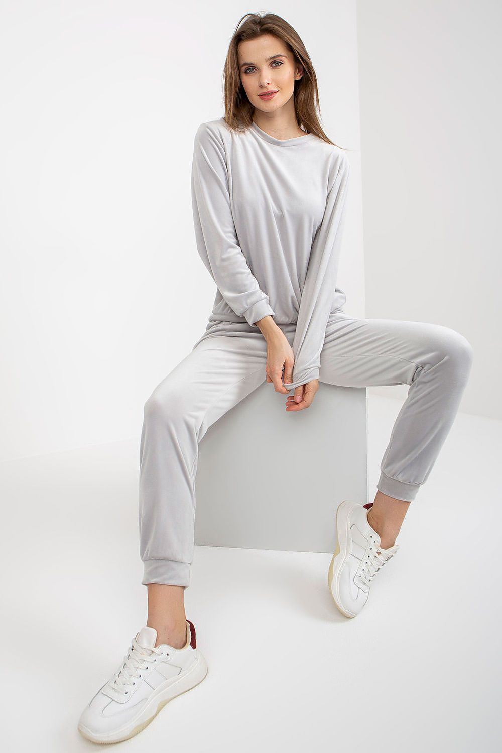 Stylish grey velour outfit by Rue Paris, featuring a chic blouse and sleek long pants, perfect for fashionable lounging or casual outings.