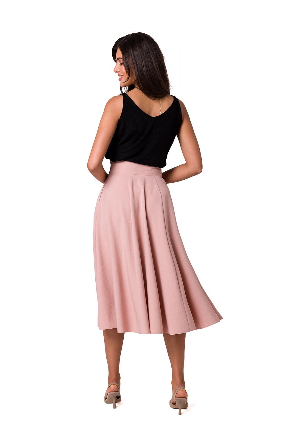 Back view of a stunning flared midi skirt by BeWear, accentuated by decorative buttons, worn by a model with a sleek black top, epitomising sophisticated elegance.