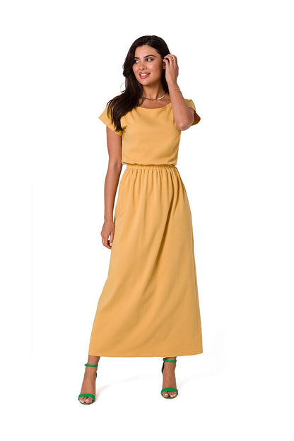 BeWear exquisite cotton maxi dress in soft yellow, styled with an asymmetrical neckline and elastic waistband, captured from the front.