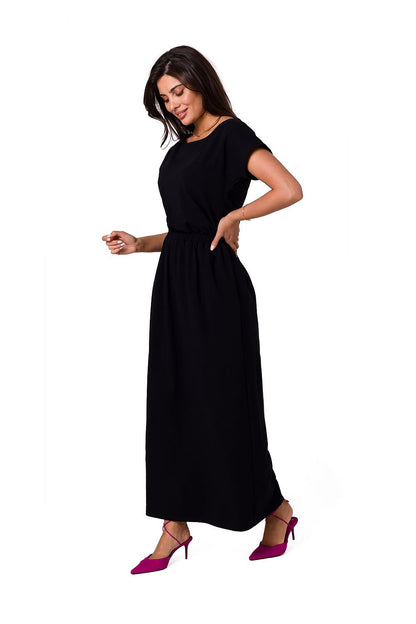 BeWear elegant cotton maxi dress in timeless black, presented from the front with an asymmetrical neckline and an elastic waistband.