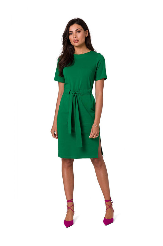 Luxurious green fitted cotton knit dress with patch pockets and belt by BeWear, elegantly showcased on a model.