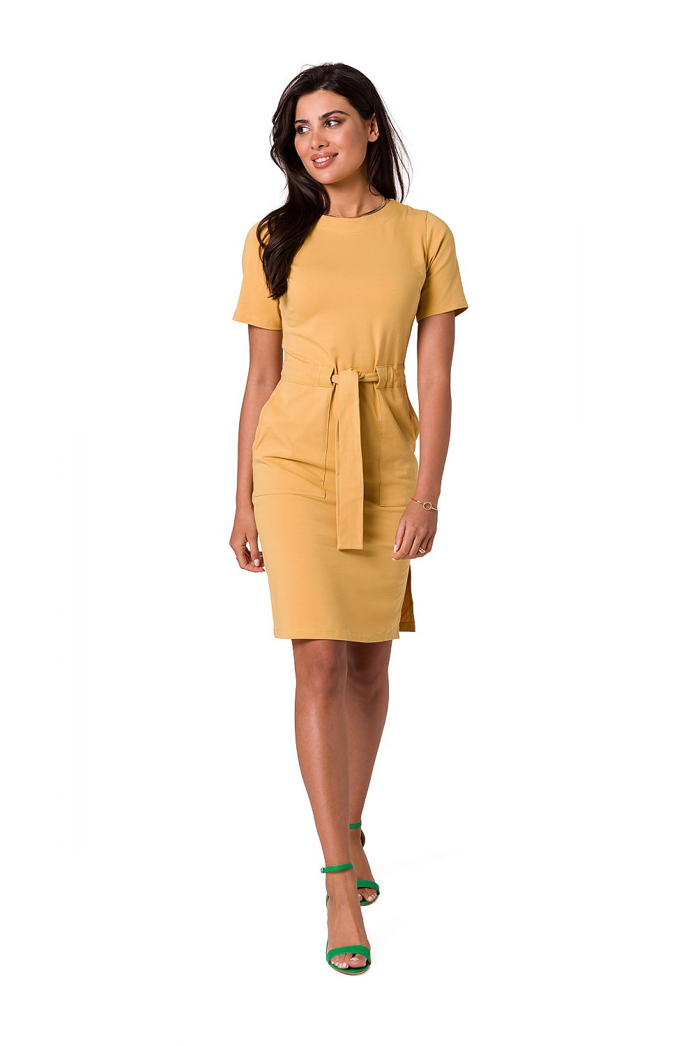 Stylish mustard fitted cotton knit dress featuring a belt, patch pockets, and side slits by BeWear, captured on a model for a luxurious look.