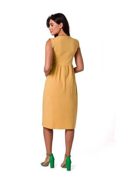 Back view of the chic yellow midi dress by BeWear, showcasing its elegant cut and fashionable details.
