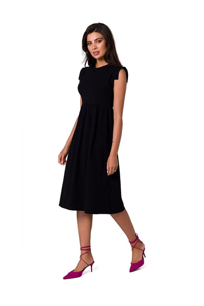 Elegant midi dress by BeWear, featuring an elevated waistline and sleeveless design, styled with pink strappy heels, perfect for chic occasions.