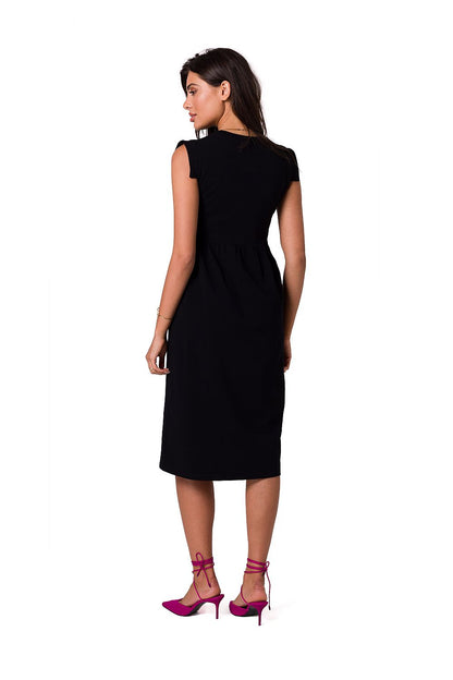 Back view of the elegant midi dress by BeWear, showcasing its flattering silhouette and sleeveless design, complemented by pink strappy heels.
