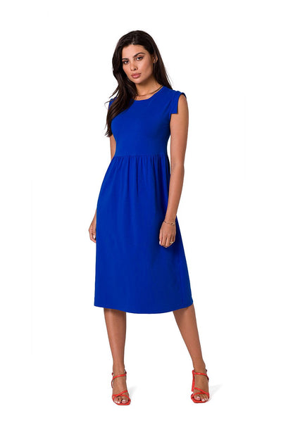 Front view of the vibrant blue midi dress by BeWear, designed with an elevated waistline and sleeveless cut, paired with red strappy heels for a stylish touch.