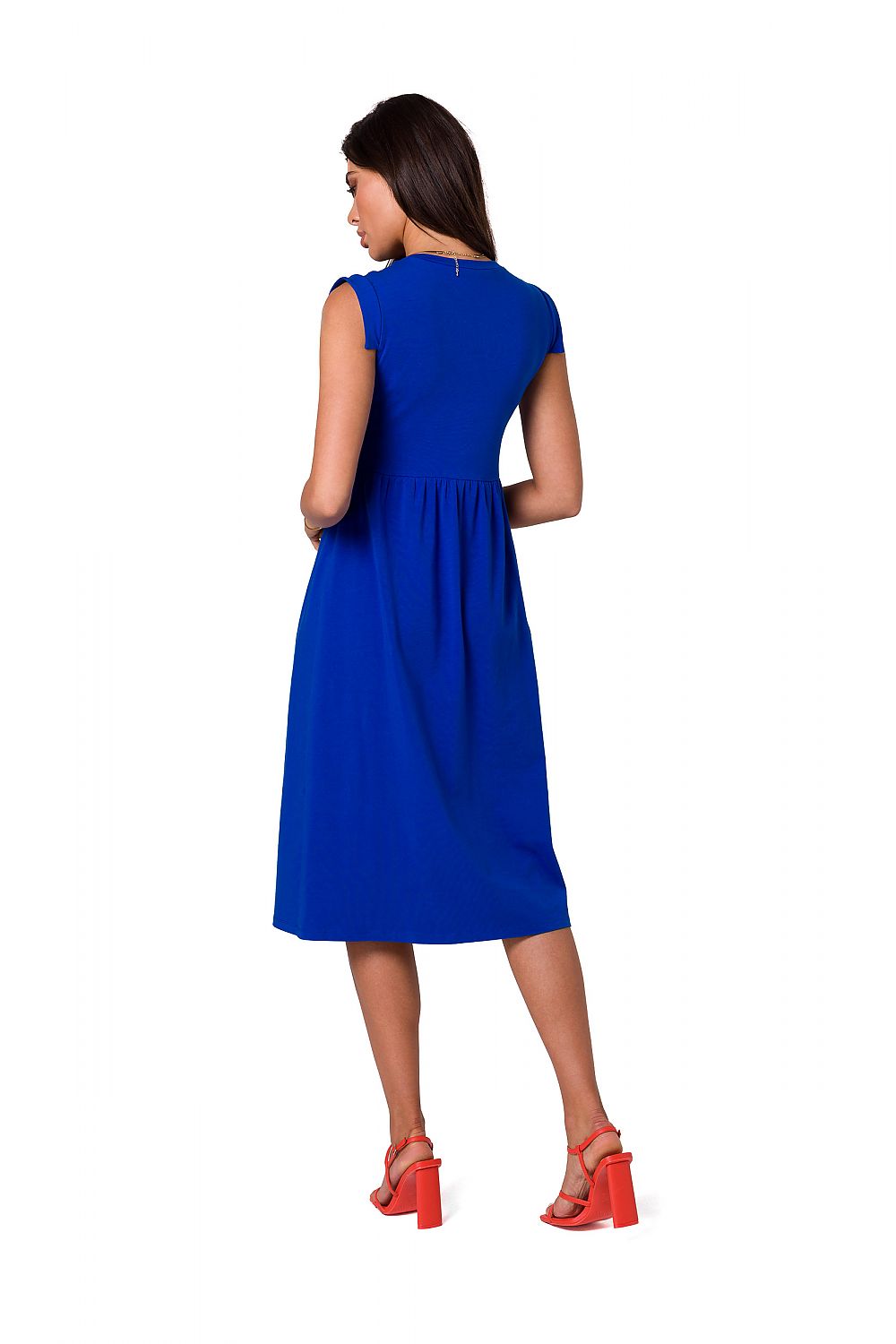 Back view of the blue midi dress by BeWear, highlighting its elegant cut and sleeveless design, styled with bright red strappy heels for a luxurious look.