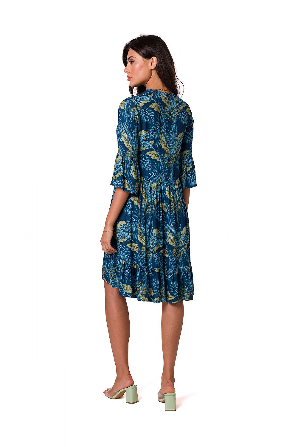 Sophisticated back view of a romantic mismatched daydress by BeWear, featuring a blue dress adorned with leafy prints and a feminine ruffle detail.
