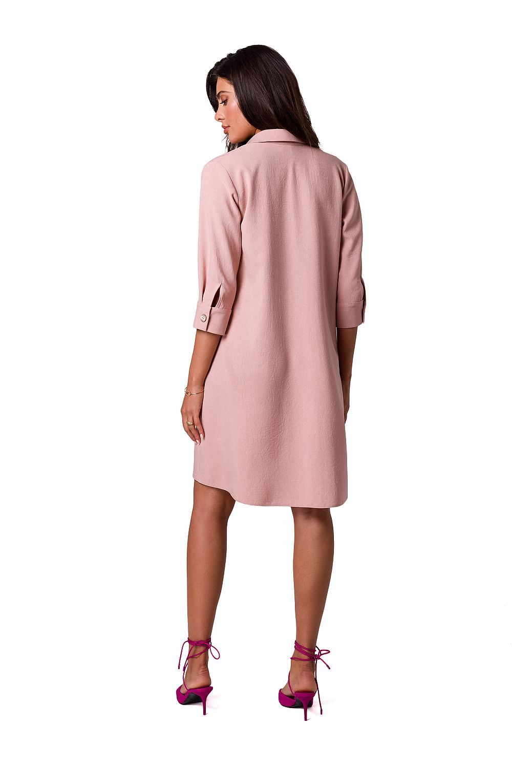 Back view of the luxurious BeWear shirt dress in blush, showcasing its refined flared design and buttoned sleeves, perfect for sophisticated occasions.