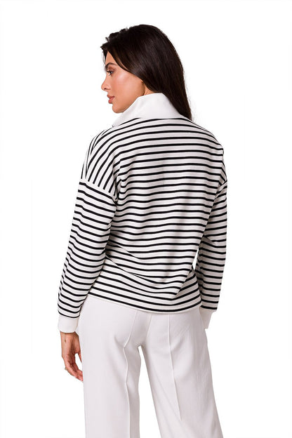 Sophisticated rear view of a woman in a BeWear high collar zip sweatshirt, highlighting its striped design and the elegant fit perfect for luxury lifestyle.