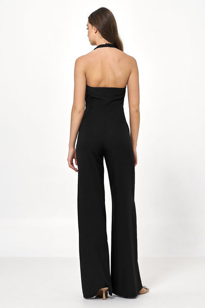 Elegant black backless jumpsuit by Nife, showcasing a fitted neckline and wide pants, epitomising effortless luxury and style for various occasions.