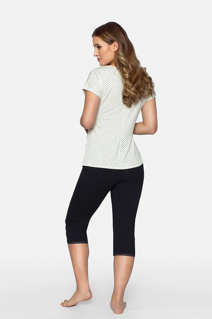 Back view of a woman wearing the Cleo luxury pajama set by Babella, featuring a pastel viscose blouse with elegant lace and sophisticated black 3/4 length pants, showcasing comfort and style.