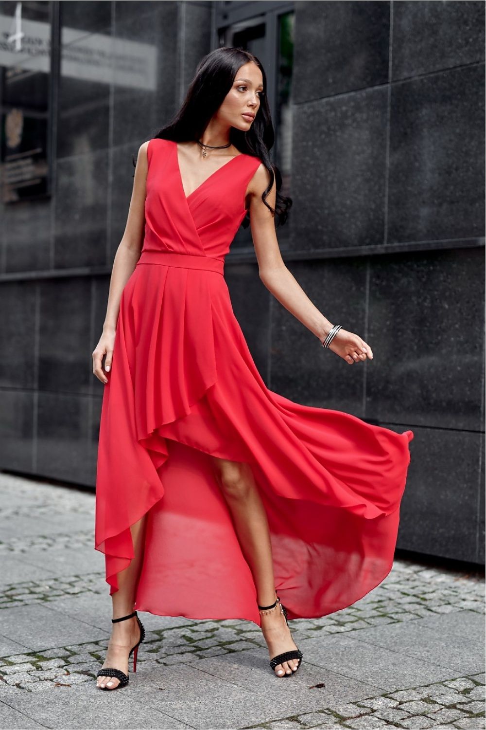 Luxurious red asymmetrical evening dress by Roco Fashion, exuding elegance with its flattering envelope neckline and flowing silhouette, designed for special events.