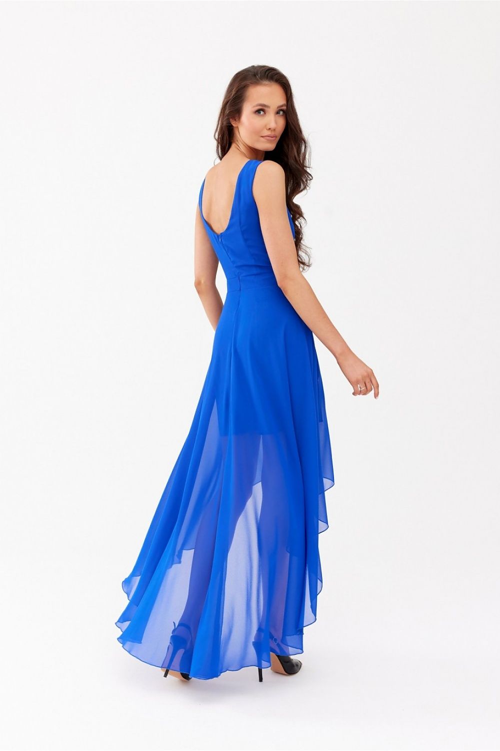 Graceful rear view of the blue chiffon evening dress by Roco Fashion, showcasing its flowing silhouette and elegant design.