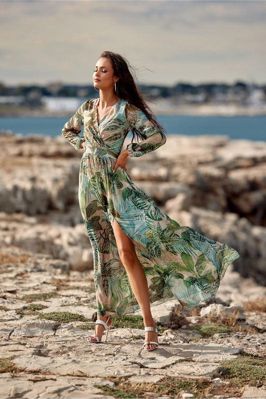 Elegant maxi daydress by Roco Fashion featuring a stylish slit and long sleeves, set against a coastal backdrop, perfect for sophisticated occasions.