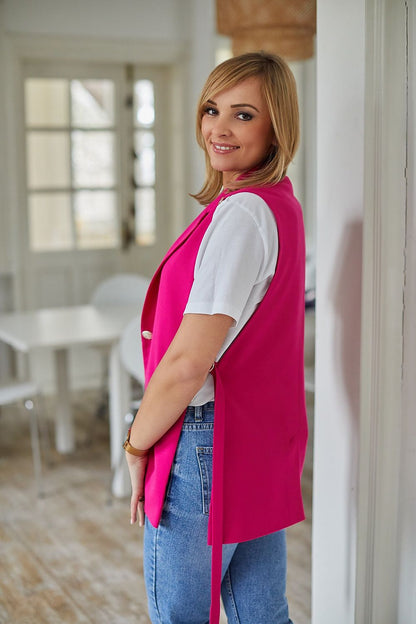 La Aurora designer jacket vest in vibrant pink, styled with a white t-shirt and trendy jeans. Perfectly tailored fit highlighting sleek lines and quality craftsmanship.