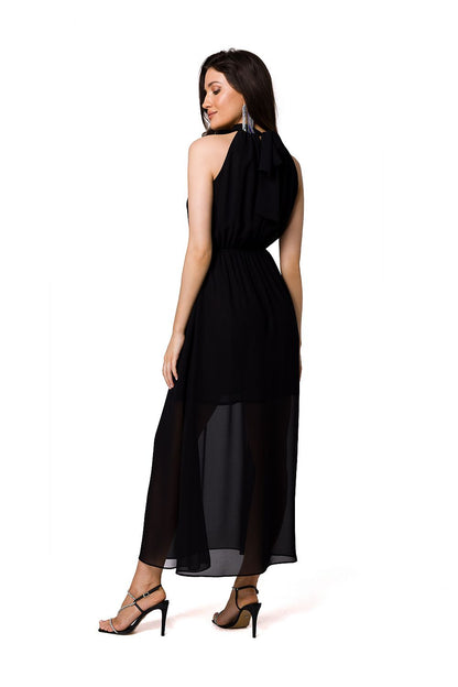 A luxurious black chiffon midi cocktail dress with a halter neckline and a tie belt from Makover, showcasing a stylish back view with elegant flowing fabric.