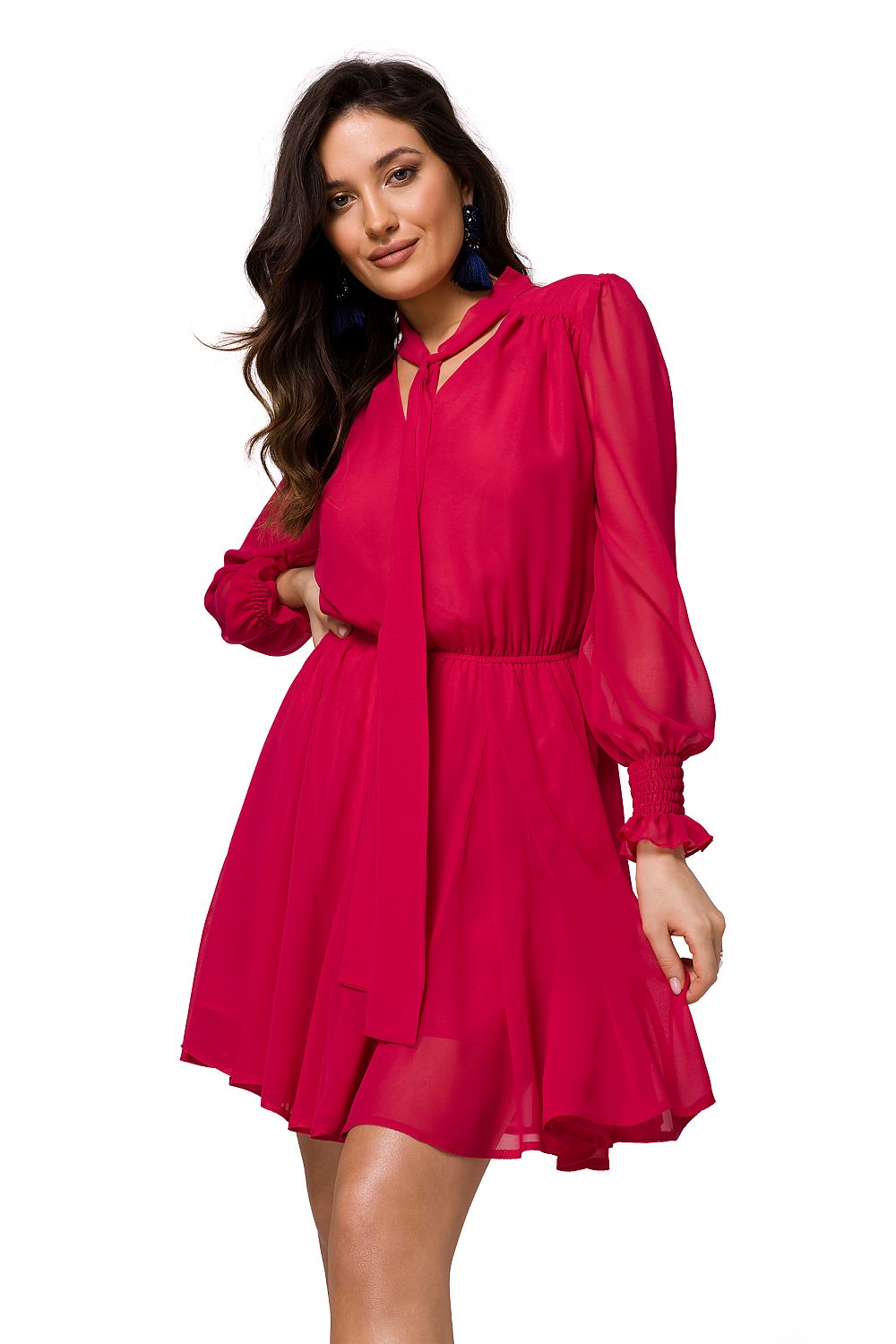 Chic model showcasing the elegant chiffon mini dress by Makover in vibrant red, with a deep neckline and soft sleeves, exuding a luxurious style for any occasion.