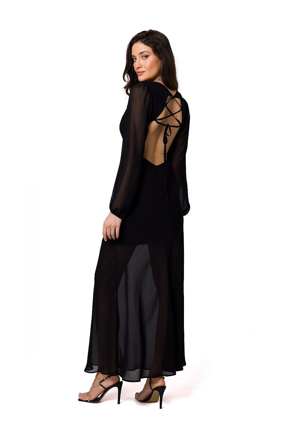 Elegant black chiffon evening maxi dress with an open back and detailed boning, showcasing a model from Makover.