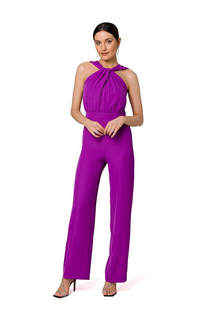 Striking purple open shoulder jumpsuit by Makover, embodying elegance with interlacing detail, perfect for classy gatherings.