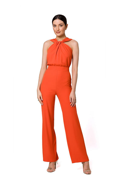 Stunning orange interlaced detail jumpsuit by Makover, featuring a chic halter neck and tailored fit accentuating elegance.