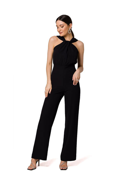 Chic black jumpsuit by Makover, featuring a beautiful halter neck design and flowing wide legs for an elegant evening look.