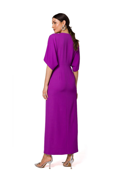 Chic purple long evening dress with high slit and kimono sleeves by Makover, model posing side profile to enhance elegance.