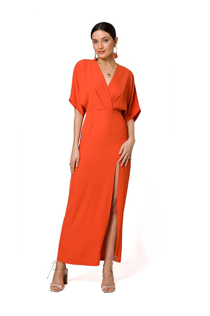 Chic orange long evening dress featuring a high leg slit, kimono sleeves, and deep V neckline by Makover, ideal for glamorous events.