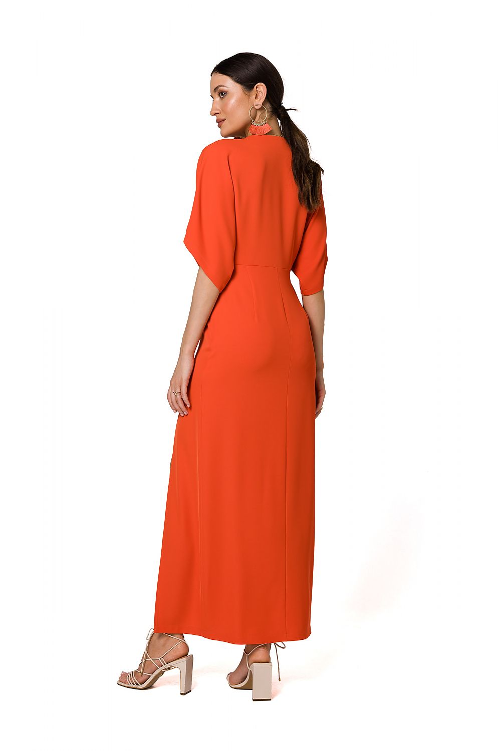 Stylish rear view of an orange long evening dress with kimono sleeves and high slit by Makover, showcasing refined elegance.