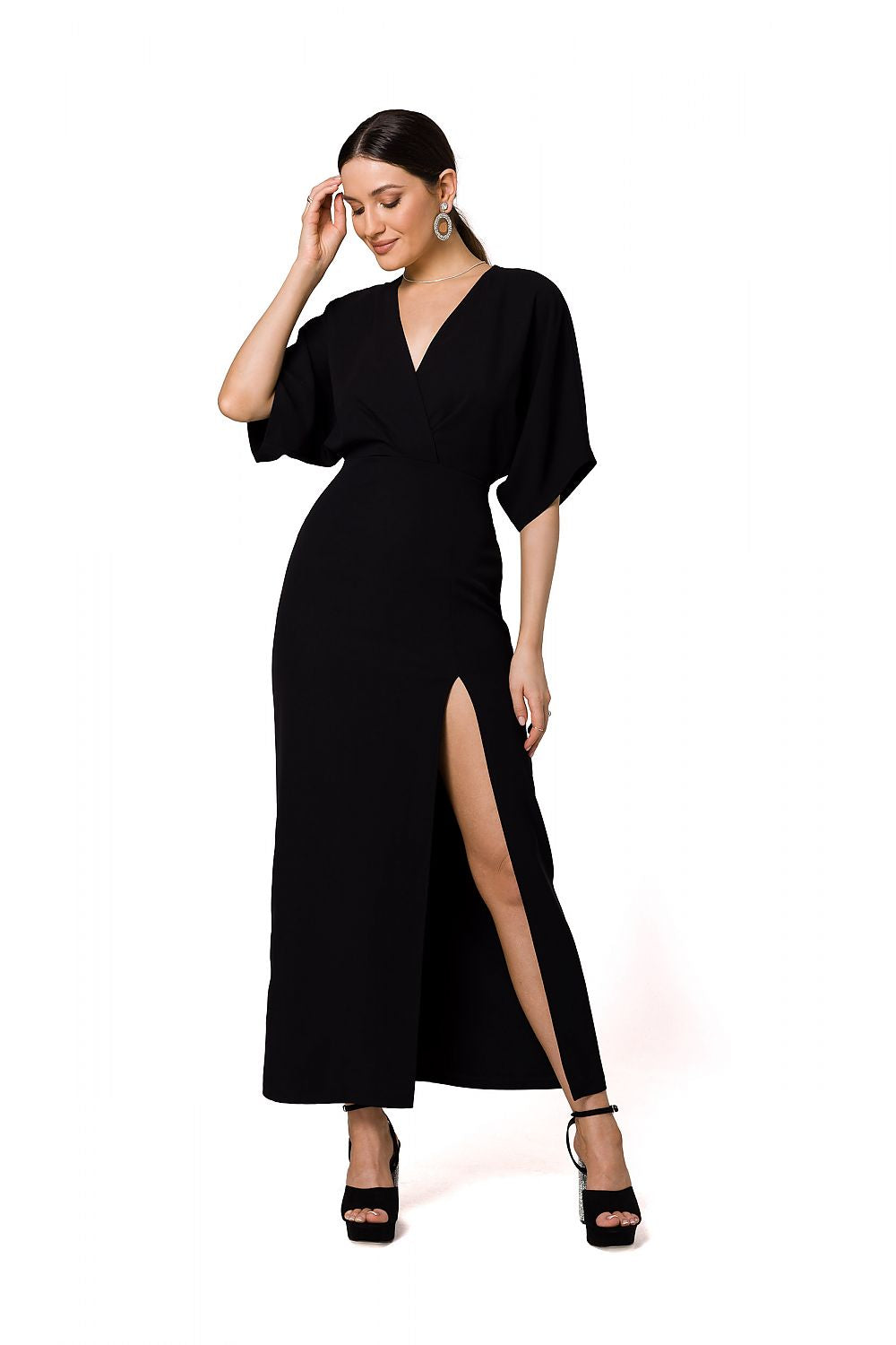 Sophisticated black long evening dress with a deep V neckline and high slit by Makover, designed for sophisticated evening wear.