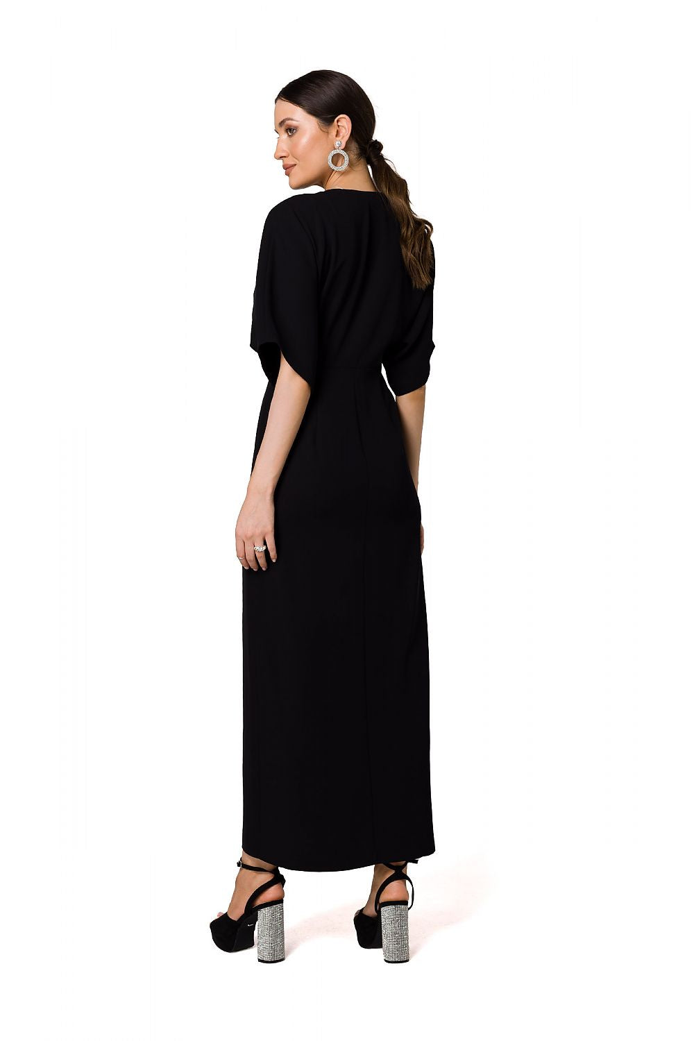 Back view of a sleek black long evening dress with kimono sleeves and high slit by Makover, exuding luxury and style.
