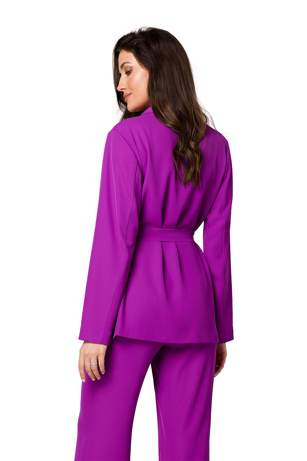 Back view of a luxury women’s flowing purple jacket by Makover, styled with matching trousers, highlighting the refined belted design.