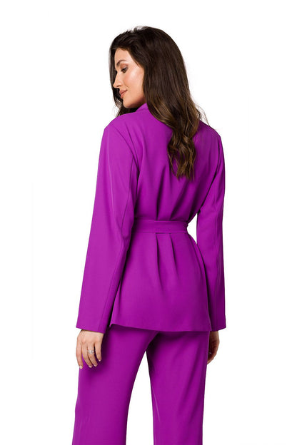 Back view of a luxury women’s flowing purple jacket by Makover, styled with matching trousers, highlighting the refined belted design.