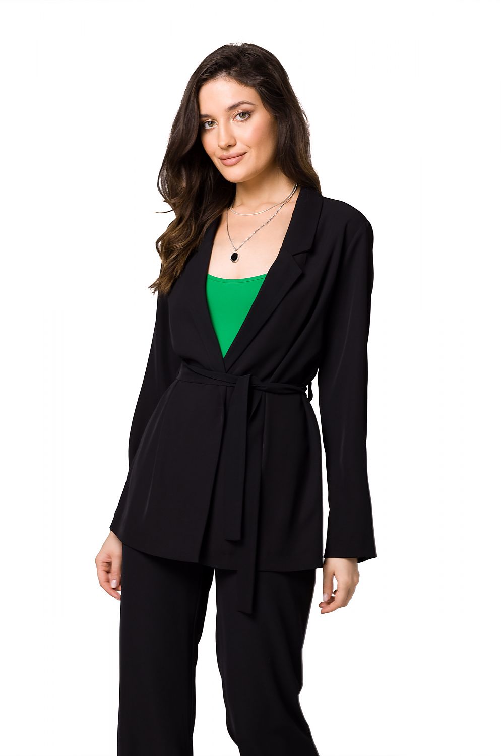 Chic black flowing women's jacket with belt, paired with a green top, exuding sophistication by Makover.