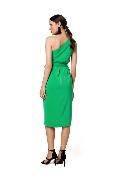 Back view of the fashionable green one-shoulder cocktail dress by Makover, featuring elegant draping and a cinched waist.