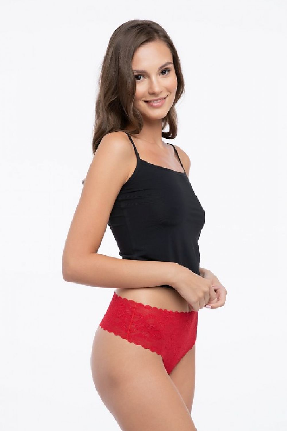 Elegant model wearing a Julimex red high rise lace thong, highlighting its seamless technology and flattering fit, ideal for stylish undergarment choices.