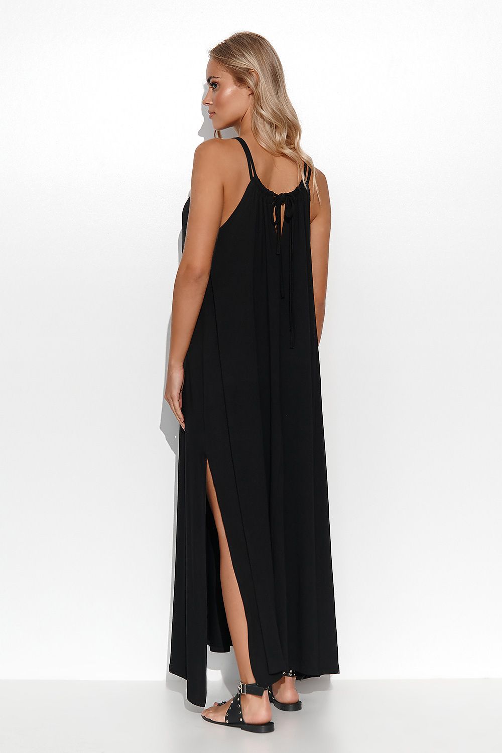 Elegant Makadamia viscose long dress featuring a side tie and delicate back slit, showcasing a stylish look from the side with an emphasis on comfort and grace.