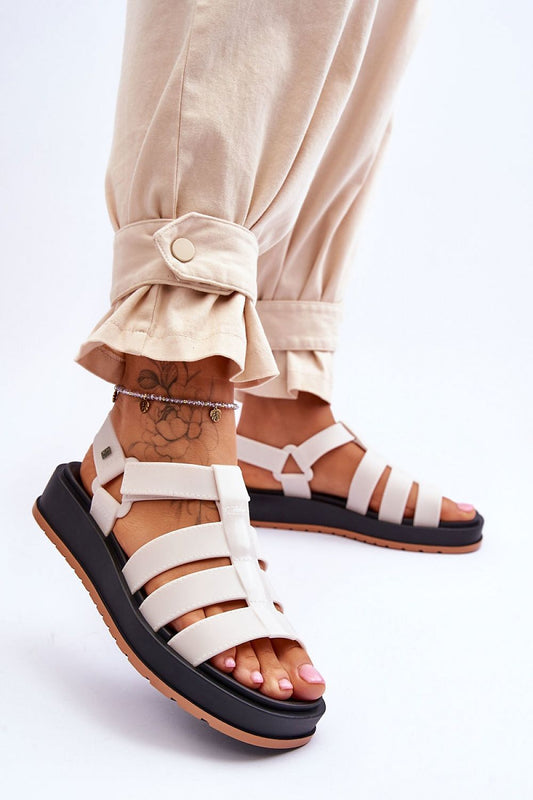 Close-up view of ZAXY Vegan Sandals showcasing their unique design with a Velcro fastening, complementing a sophisticated ensemble, from Step in Style.