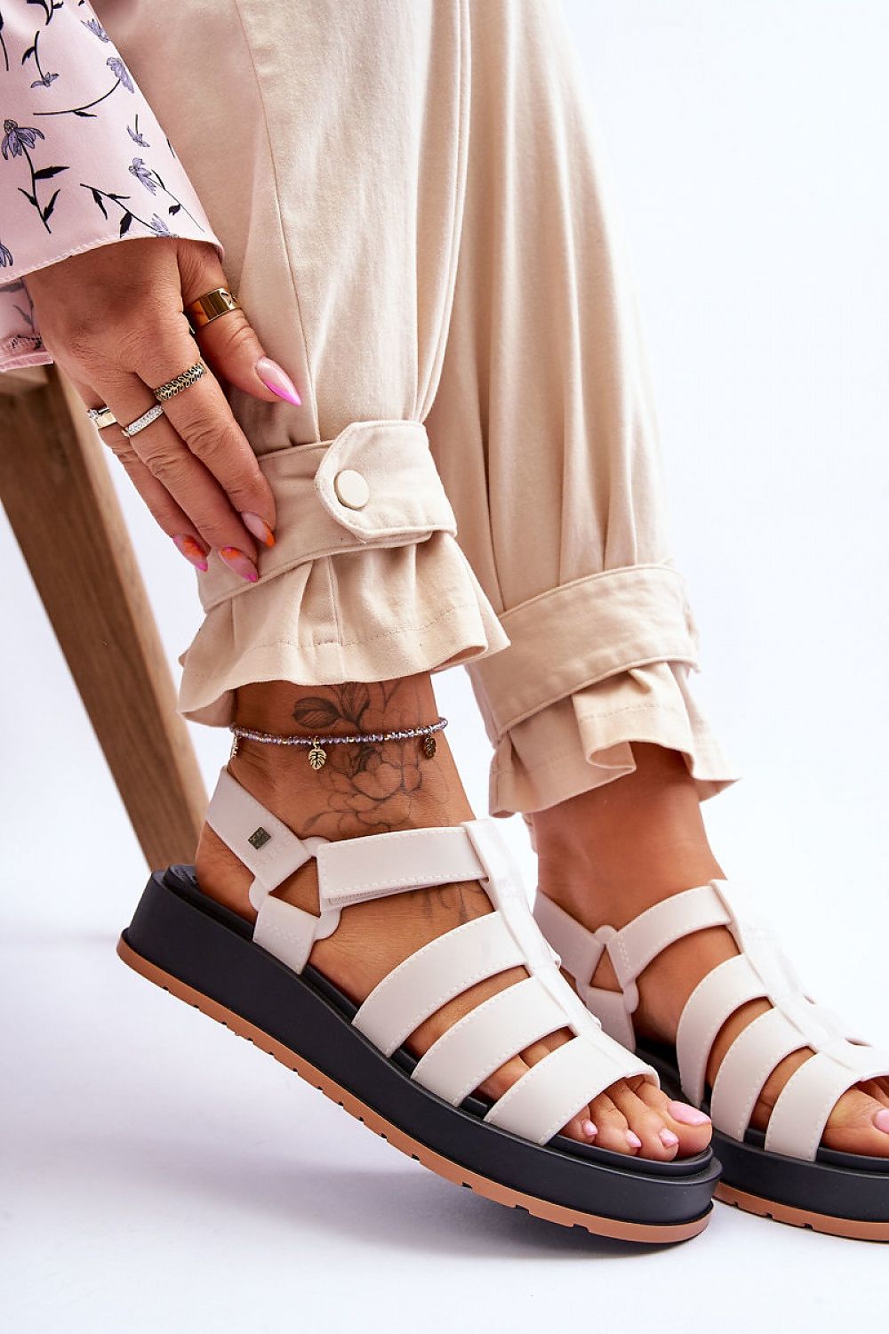 Fashionable portrayal of ZAXY Vegan Bubble Gum-Scented Sandals, highlighted against beige trousers, ideal for stylish summer vibes, by Step in Style.