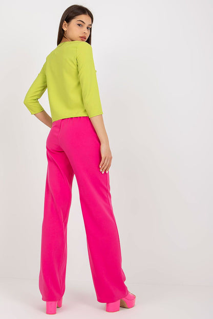 Elegant Lakerta blouse in vibrant lime green with 3/4 sleeves, paired with stylish pink trousers, showcasing a chic back view.