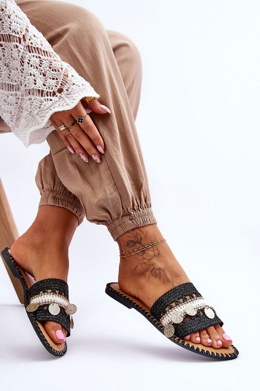 Elegant women's flip-flops with decorative hoops and lurex, showcasing a stylish design by Step in Style. The model is wearing the flip-flops, displaying a chic outfit that complements the footwear.