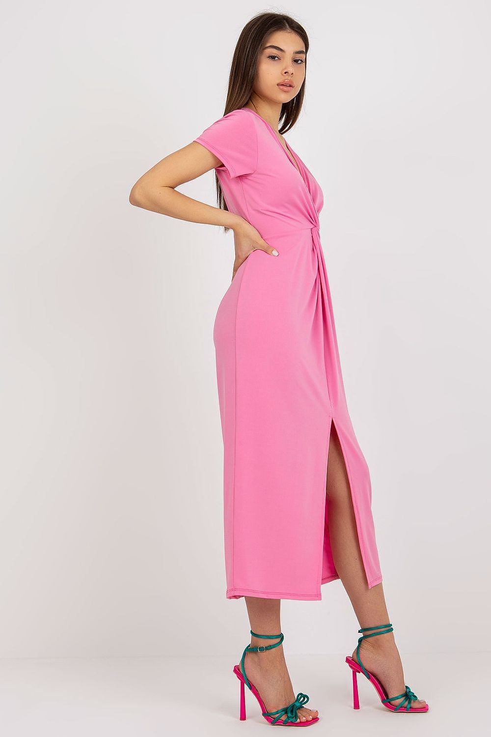 Graceful side angle of a pink daydress featuring a twisting front and stylish side slit, designed by Italy Moda, embodying elegance and comfort.