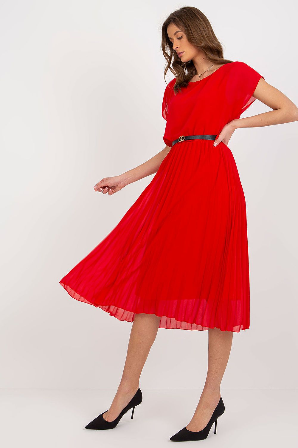 Luxury red pleated cocktail dress by Italy Moda, highlighted on a model in an elegant pose showcasing its stylish silhouette and black belt for formal celebrations.