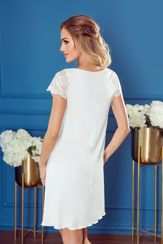 Stylish back view of the Eldar sensual nightgown with lace detailing, showcasing its elegant silhouette and sophisticated design in a captivating blue setting.