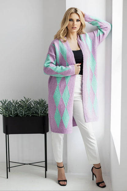 Chic purple and teal geometric pattern cardigan by PeeKaBoo, effortlessly worn over a stylish black top and white trousers, exuding luxury and comfort.