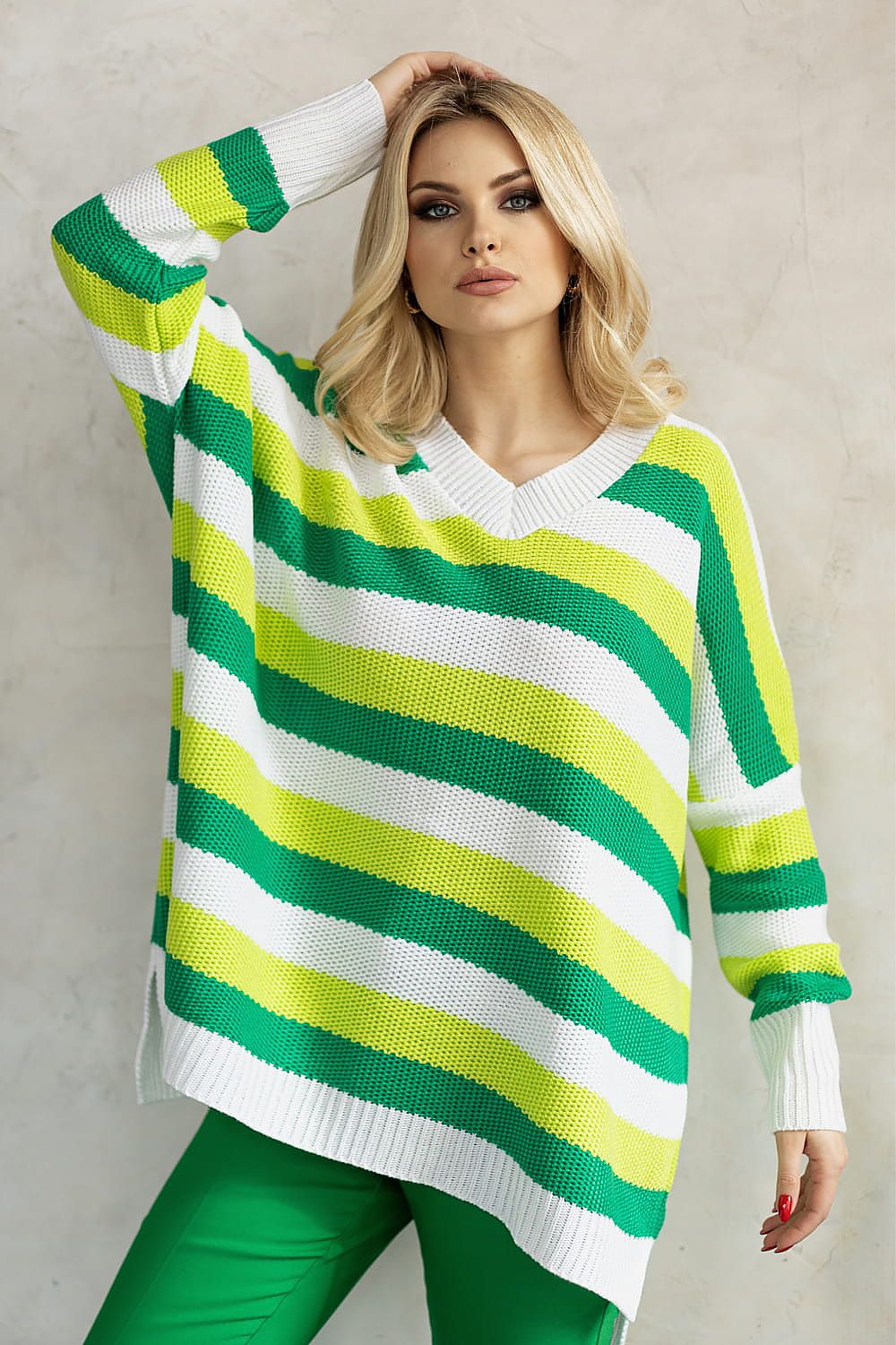 Sophisticated acrylic sweater in vibrant green and yellow stripes, featuring a heart neckline, paired with stylish look, by PeeKaBoo.